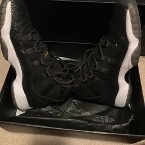 Black and gold sparkly high top Jordan 11’s
